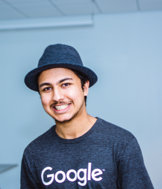 Smiling student wearing a hat and a Google tshirt